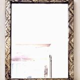 Small Art Deco carved wooden mirror, silver leaf.