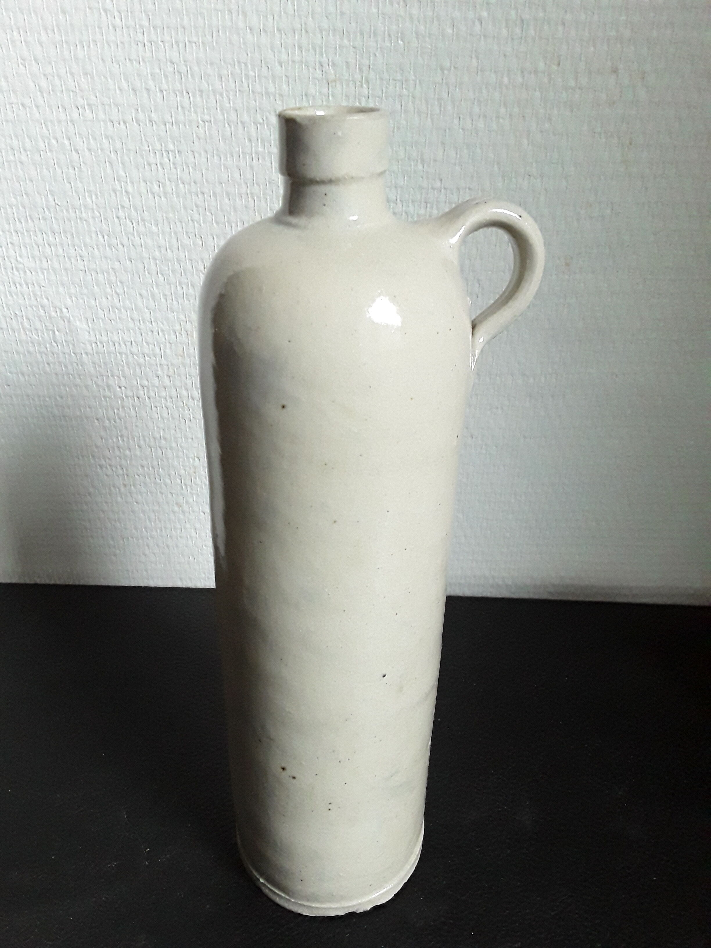Vintage glazed stoneware bottle with handle