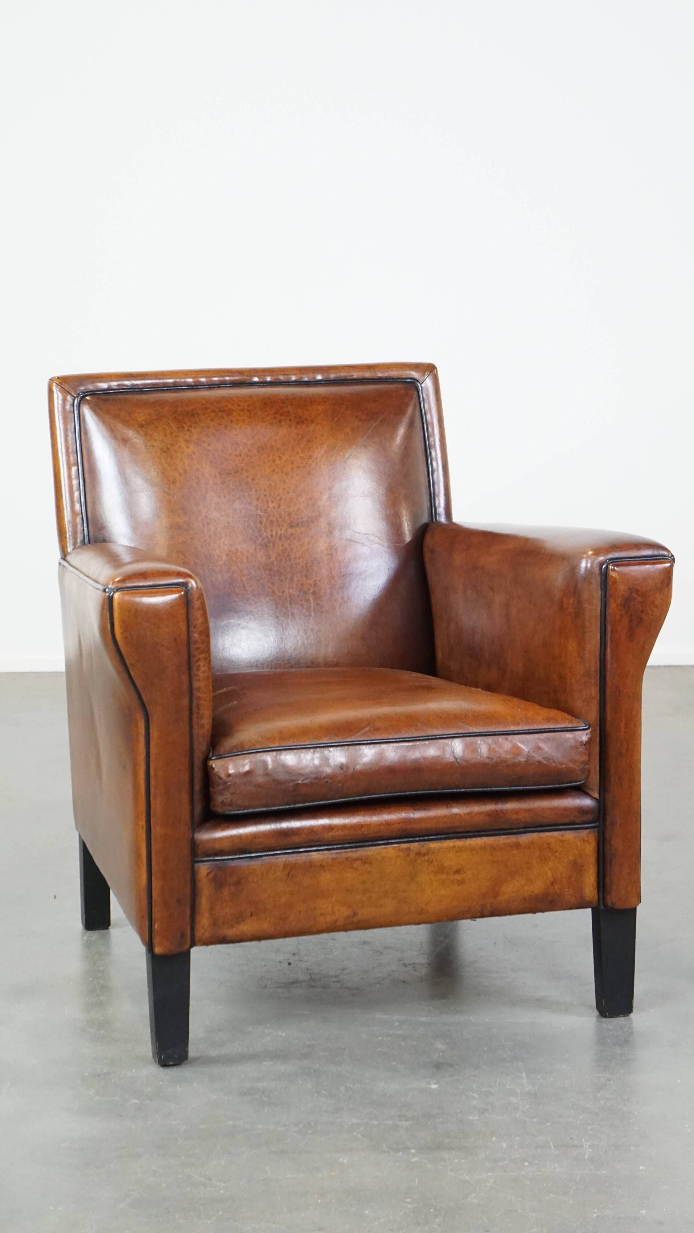 Cognac-colored sheep leather Art Deco design armchair finished with piping