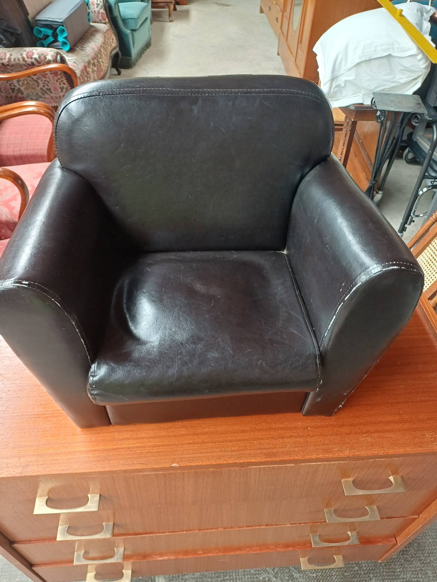 Mini black leather armchair for children