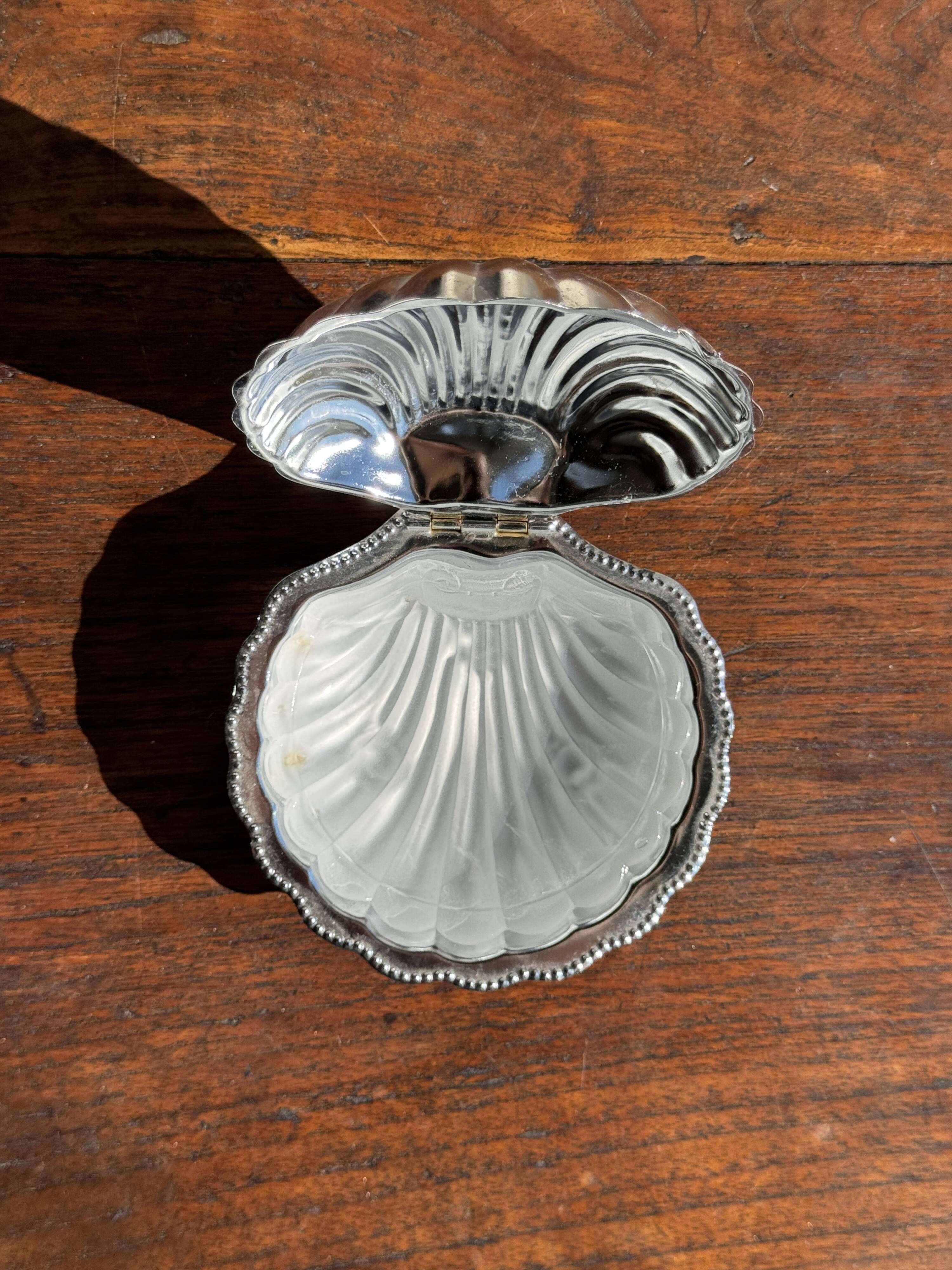 Vintage silver-plated shell butter dish with transparent bowl.