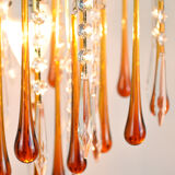 A pair of Mid Century 70's waterfall chandeliers. Murano glass amber drops. Paolo Venini style.