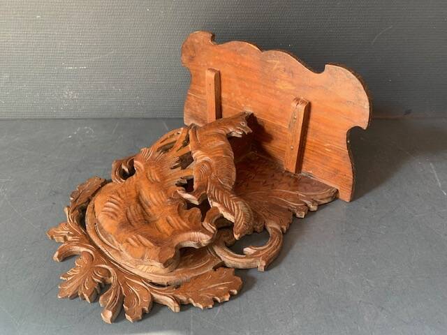 Black Forest carved wooden wall console, harness with wolf decoration