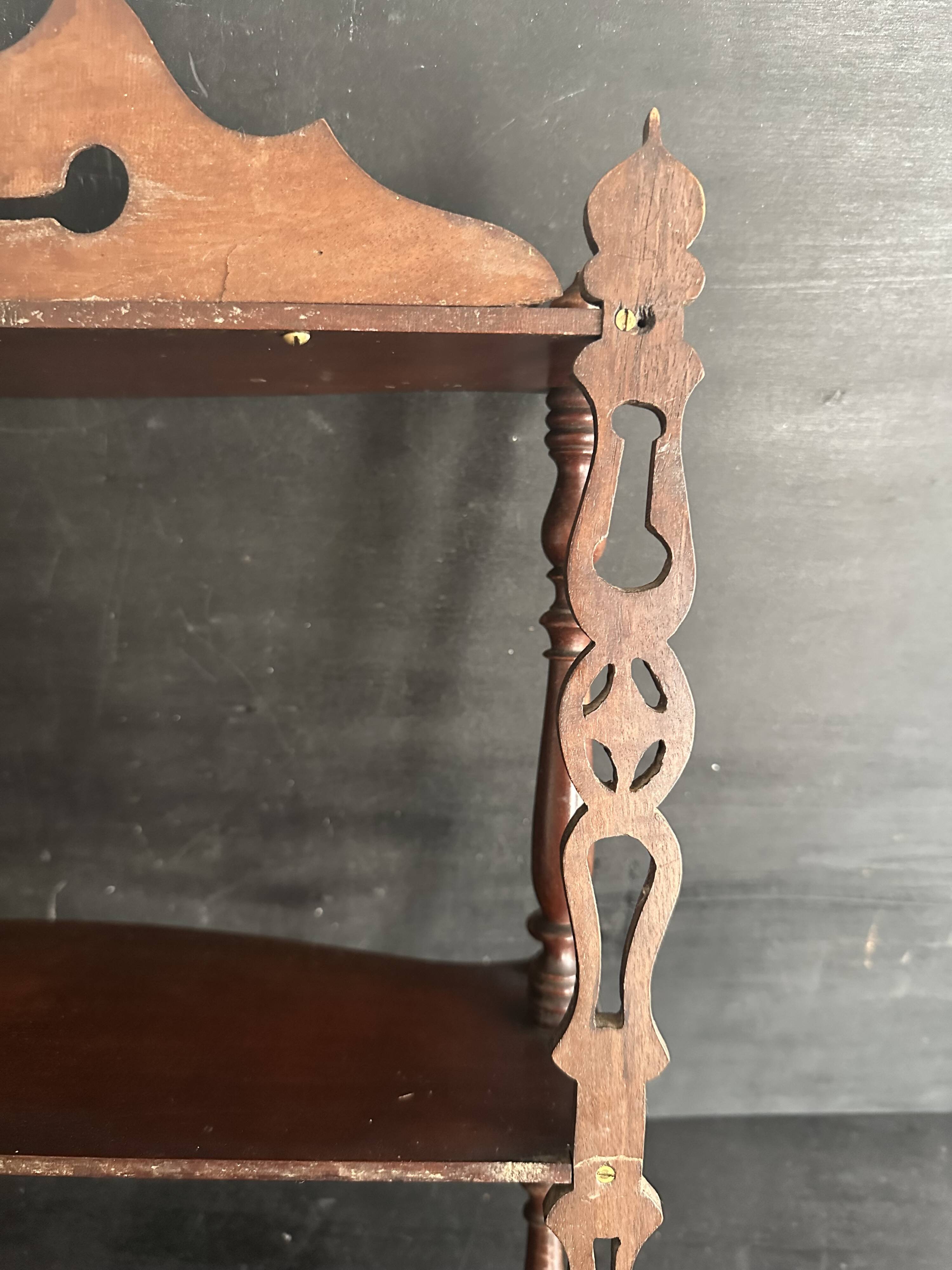 Napoleon III wall shelf in turned wood with a pediment.