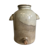 Old vinaigrier in sandstone vintage pot