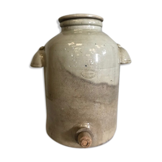 Old vinaigrier in sandstone vintage pot