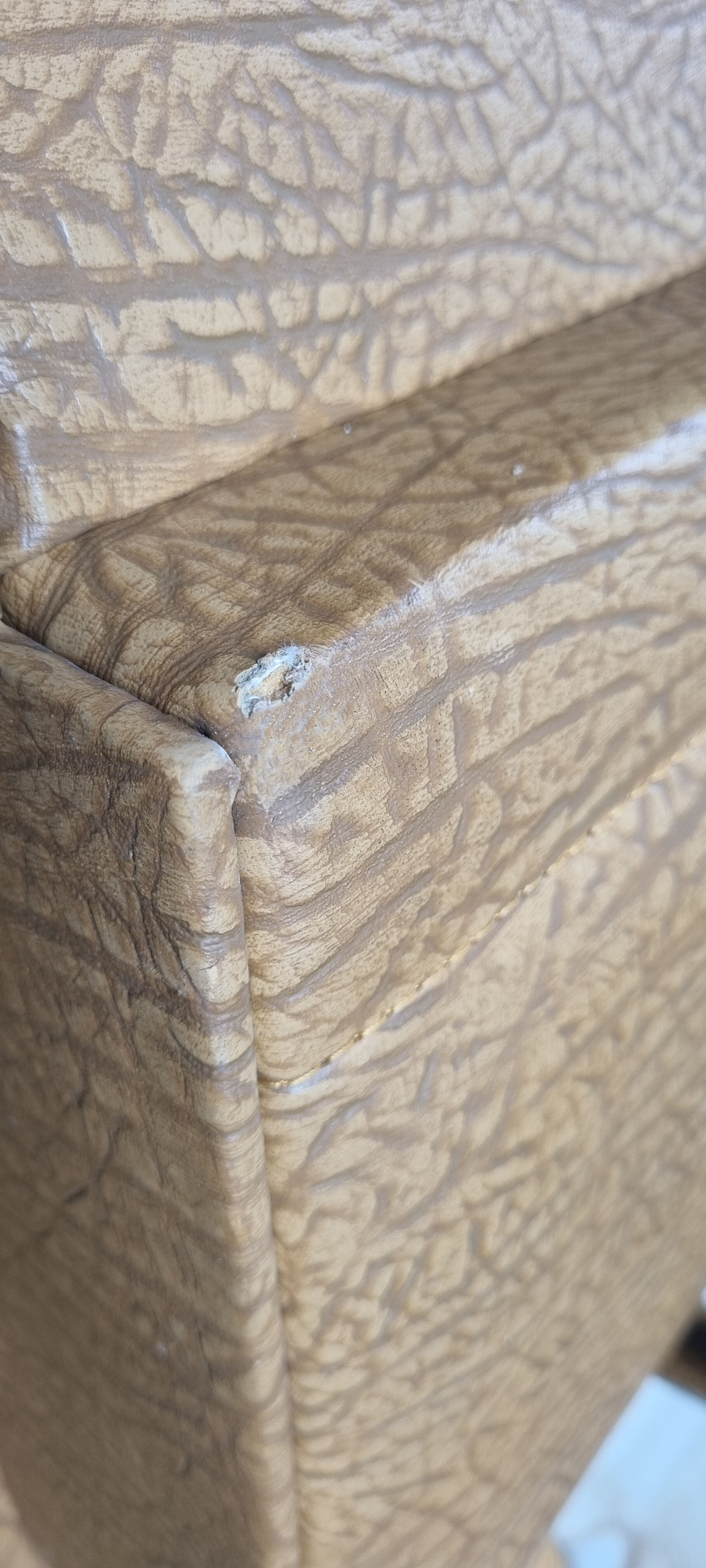 Pair of mustard skaï armchairs, brass feet