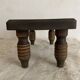 Low stool, turned wooden legs.