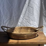 Large flat oval woven rattan basket with handles, Indonesian L53x64
