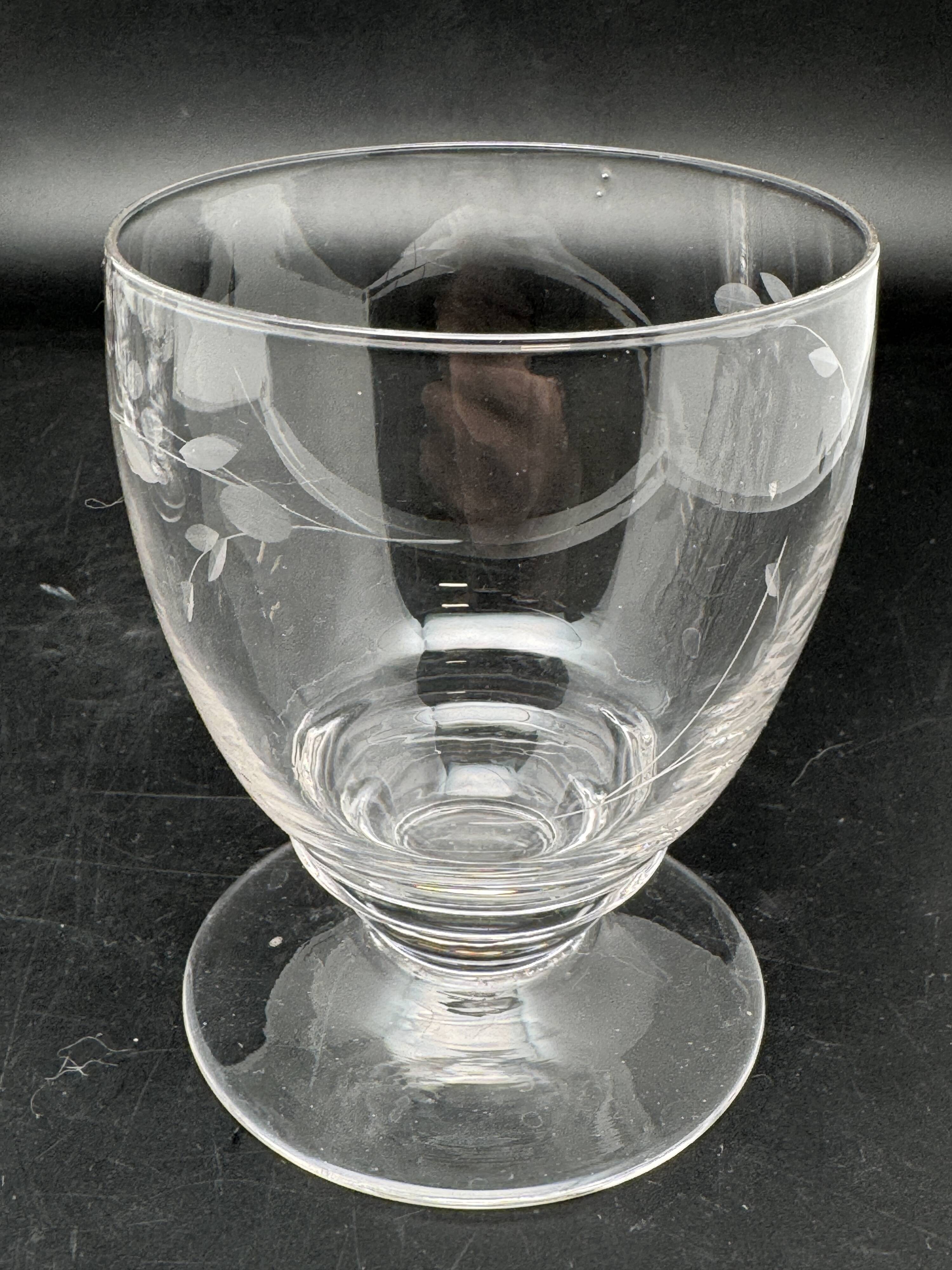 Set of fine glass stemmed glasses with small flower patterns