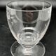 Set of fine glass stemmed glasses with small flower patterns