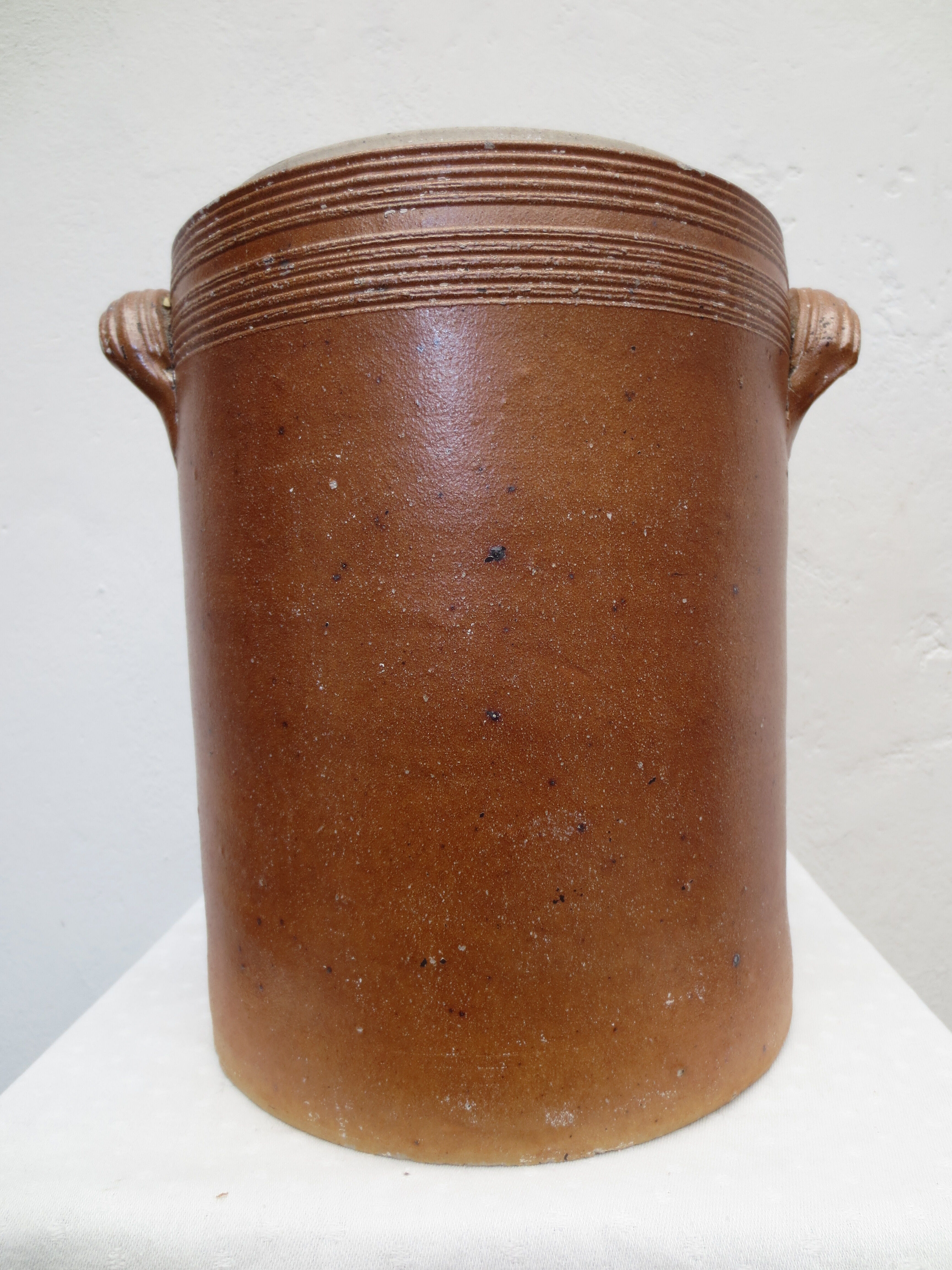 Old butter jug in flaming sandies