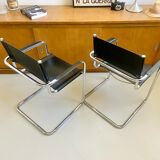 Pair of vintage chrome and black faux leather armchairs