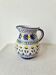 Vintage ceramic pitcher/vase hand-painted with floral decoration.