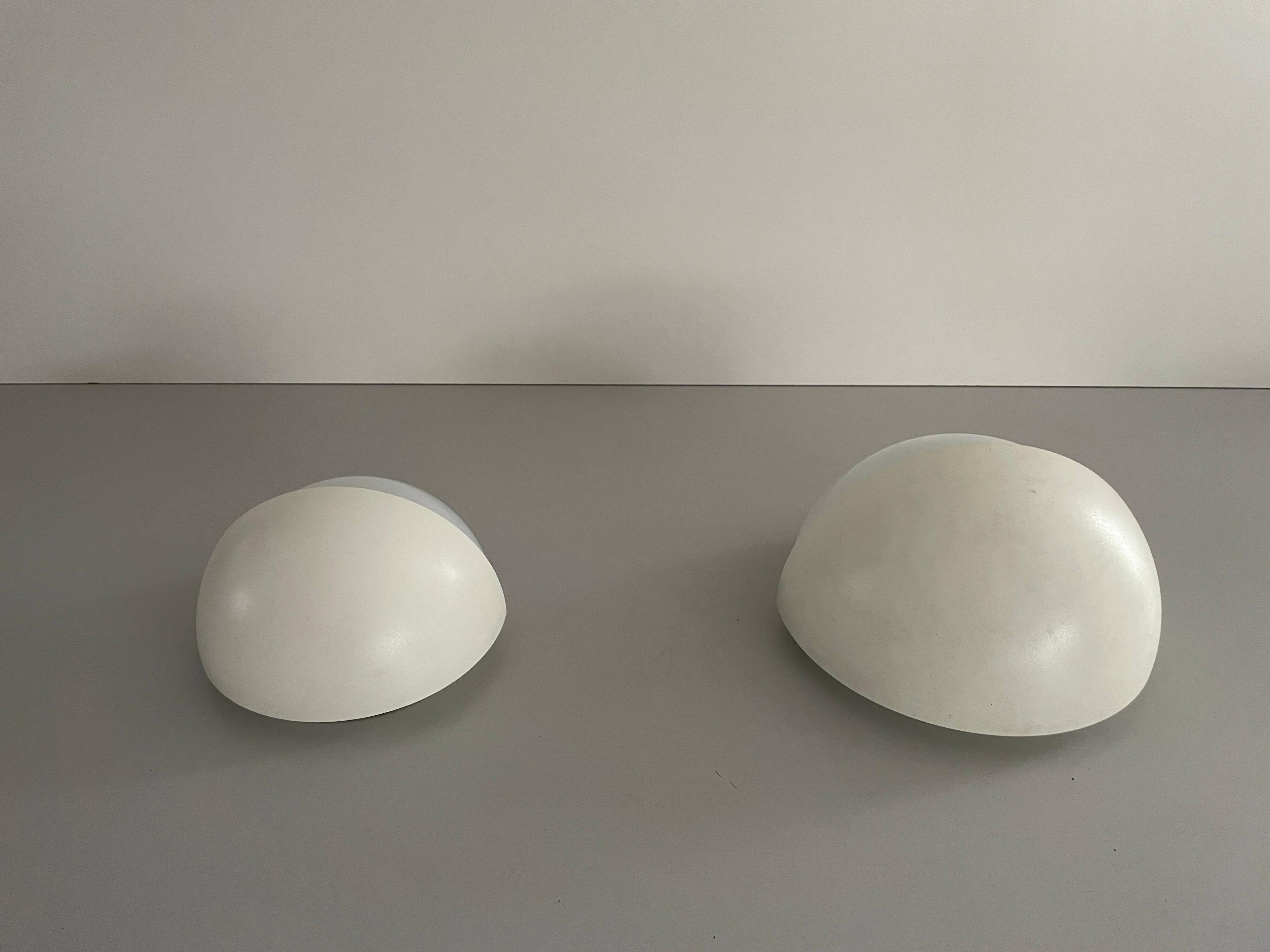 Round wall lights, small and large, in white metal by Bega, 1970s, Germany.