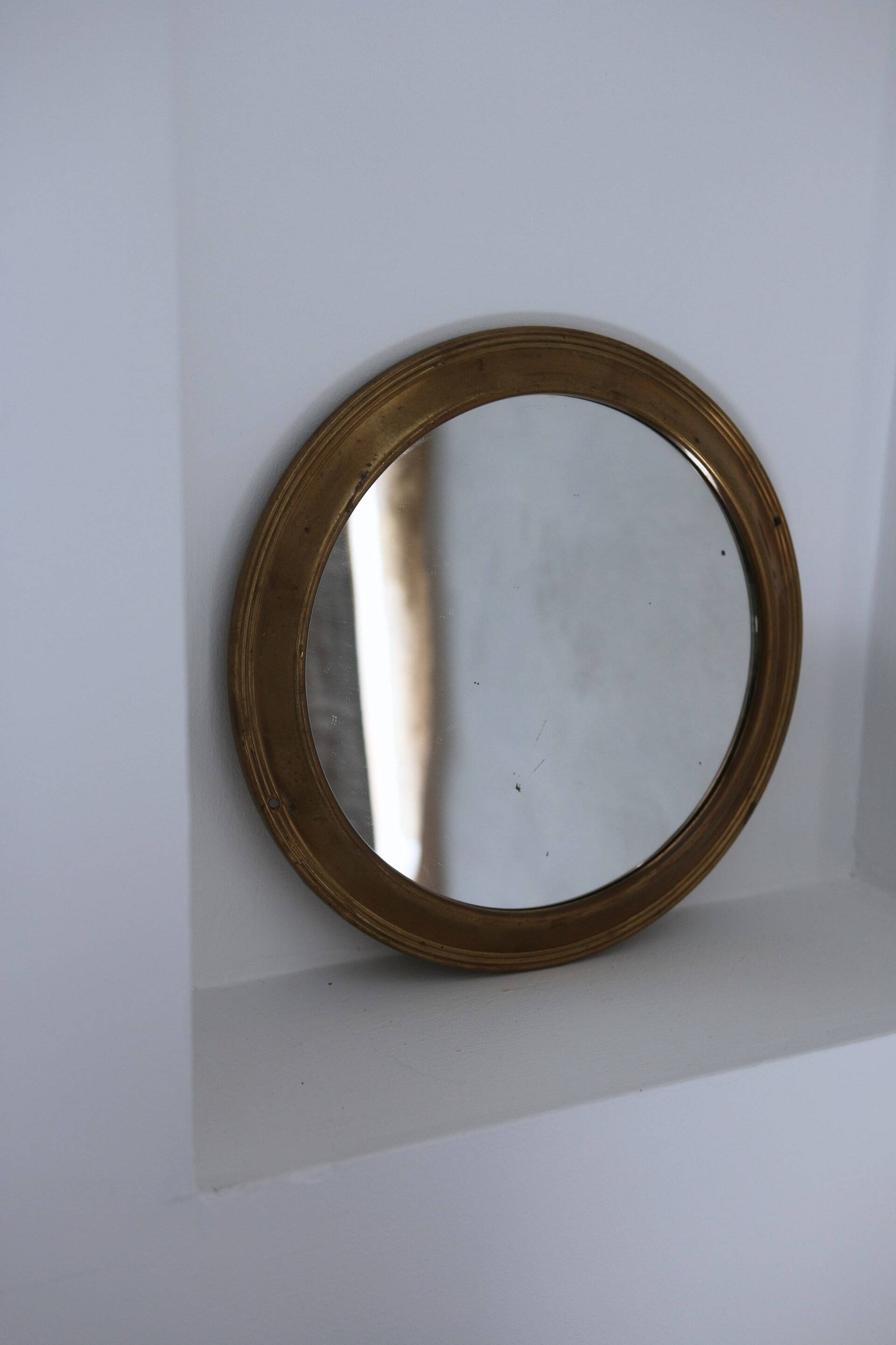 Antique round brass mirror