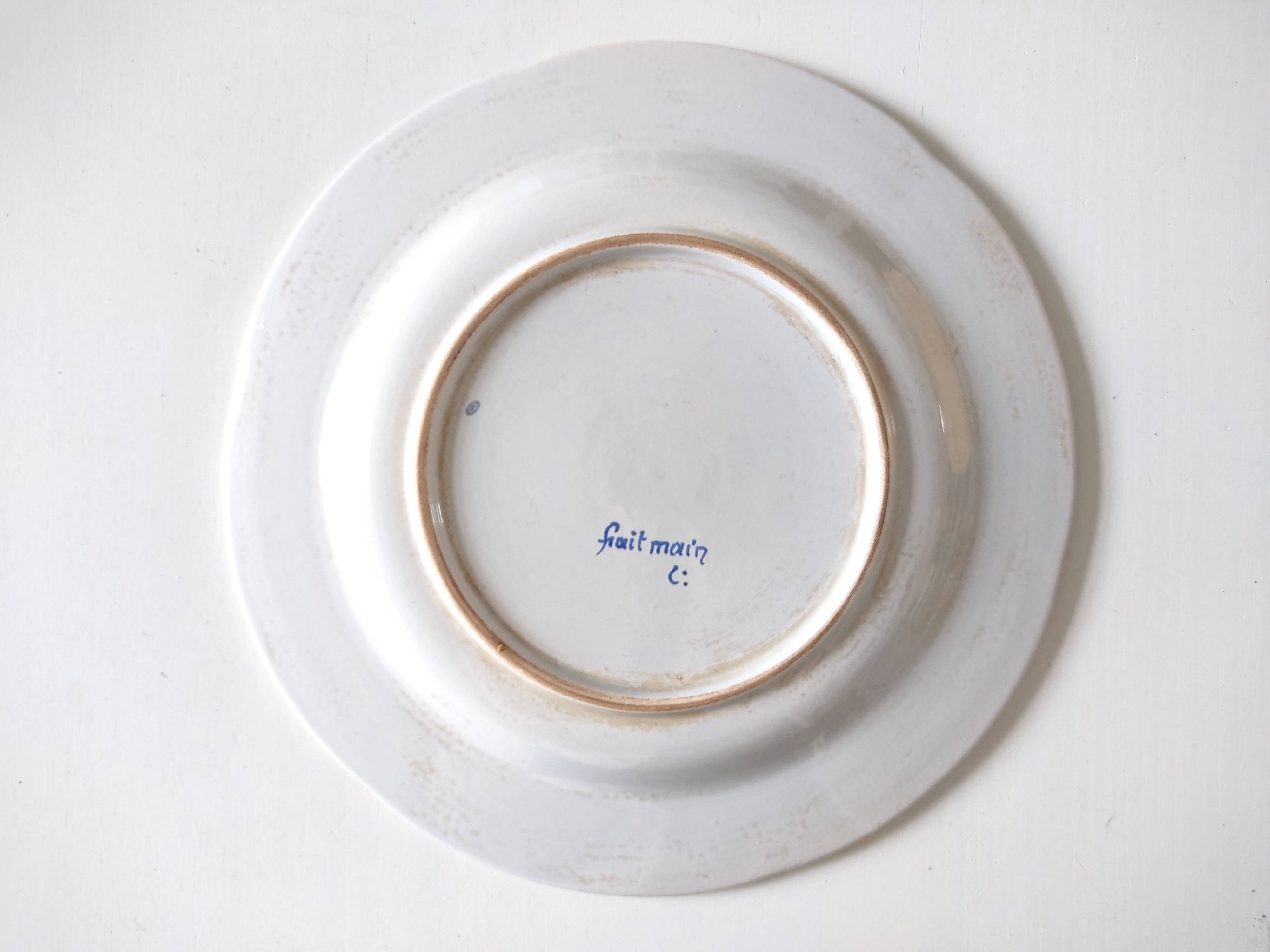 Decorative blue and white earthenware plate