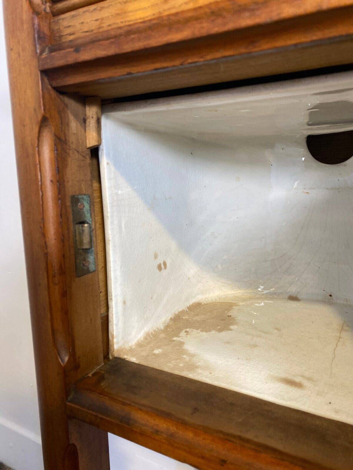 Provincial oak furniture, marble top, ceramic interior.