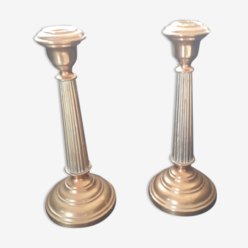 Pair of old candle holders made of thick brass;