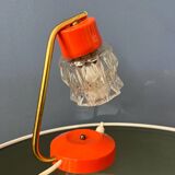 Small orange desk lamp with clear crystal glass shade