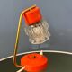 Small orange desk lamp with clear crystal glass shade