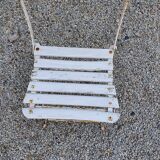 Wooden slatted garden chair with wooden slats and iron feet