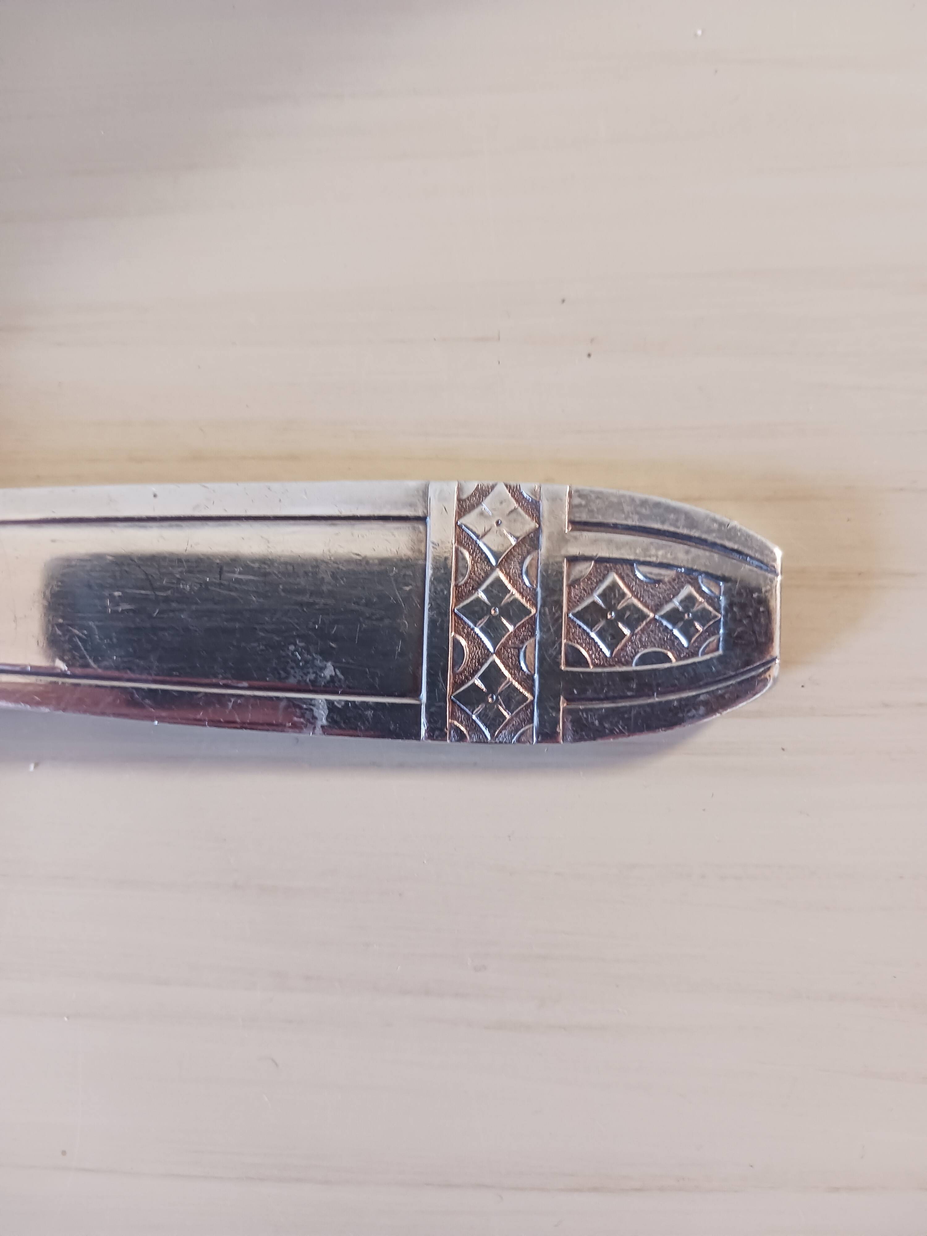 Silver-plated metal ladle, art deco motif.