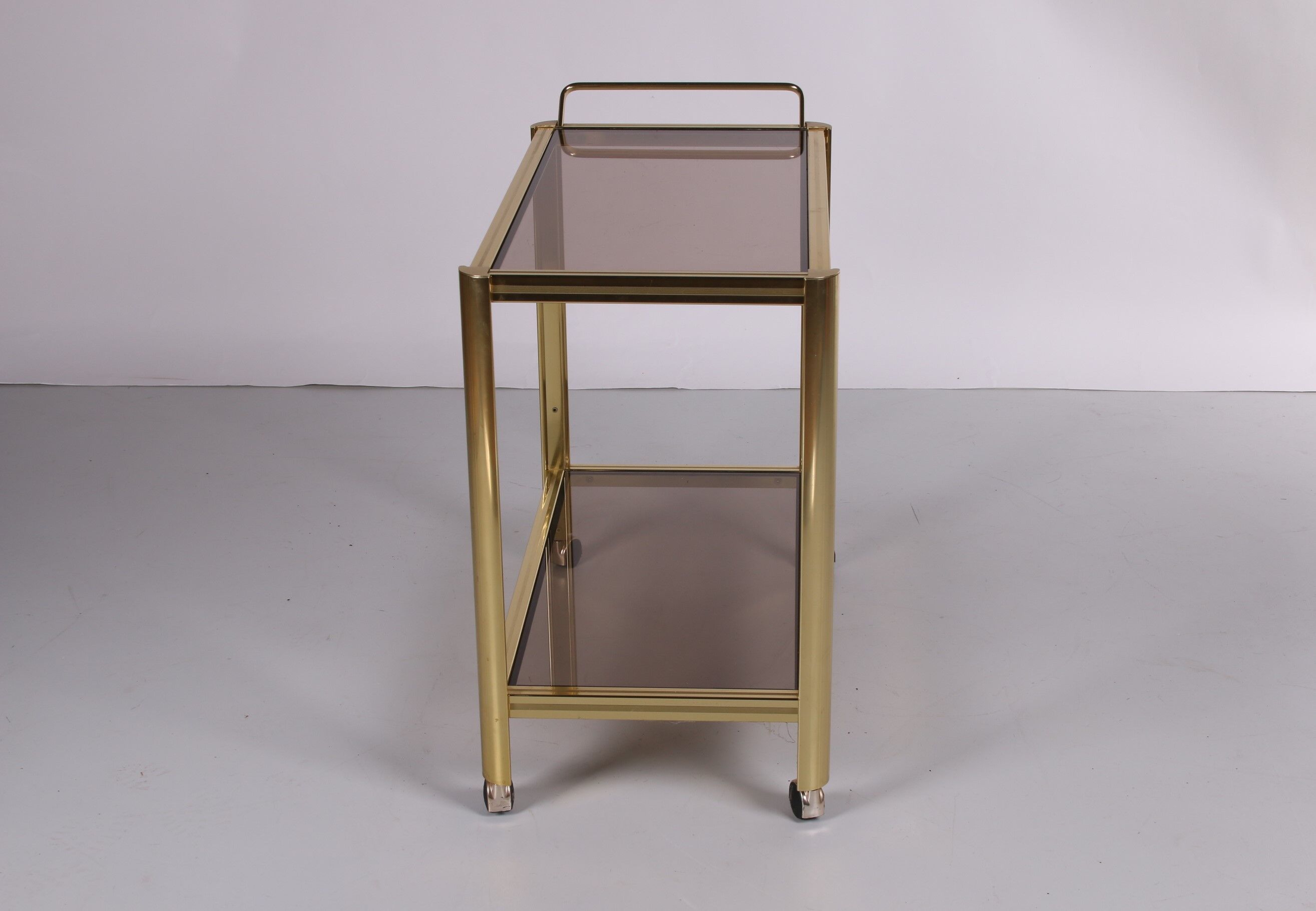 Hollywood Regency trolley with smoked glass