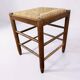 Tabouret vintage avec assise en paille