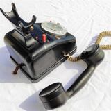 Telephone in black bakelite dial with call system