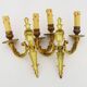 Old pair of bronze double-light wall sconces. 60s