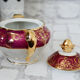 Teapot in Limoges porcelain, burgundy and gold
