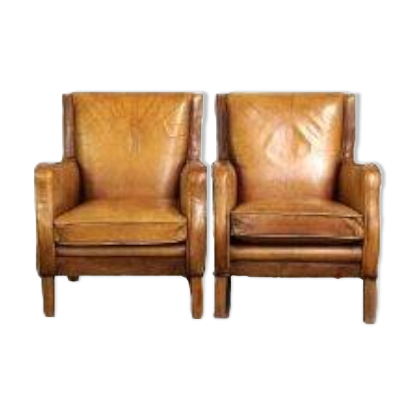 Set of English style light cognac colored leather armchairs.