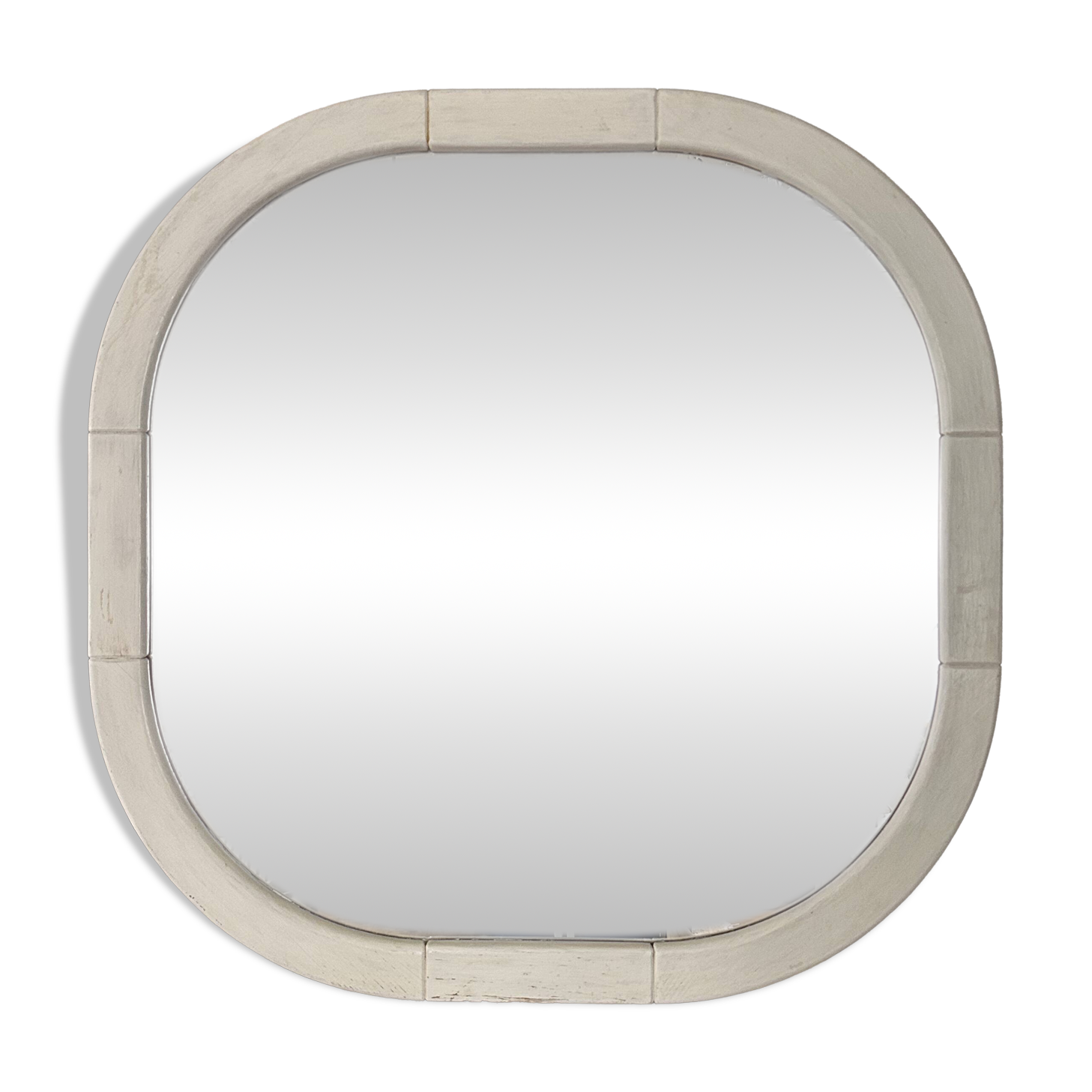 Large Space Age wall mirror in white-patinated wood. France, 1970s