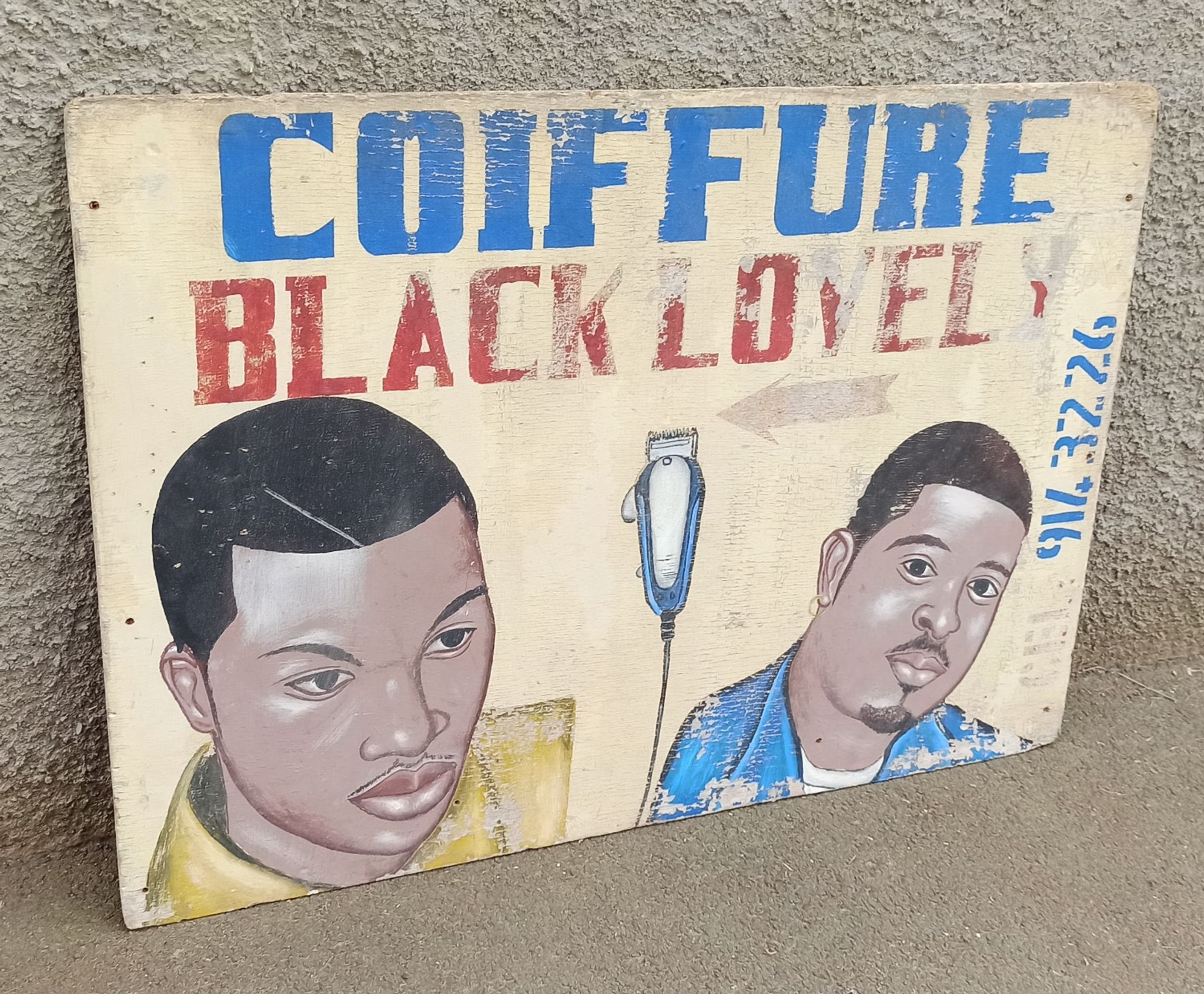 Ancienne enseigne de coiffeur africain