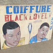 Ancienne enseigne de coiffeur africain