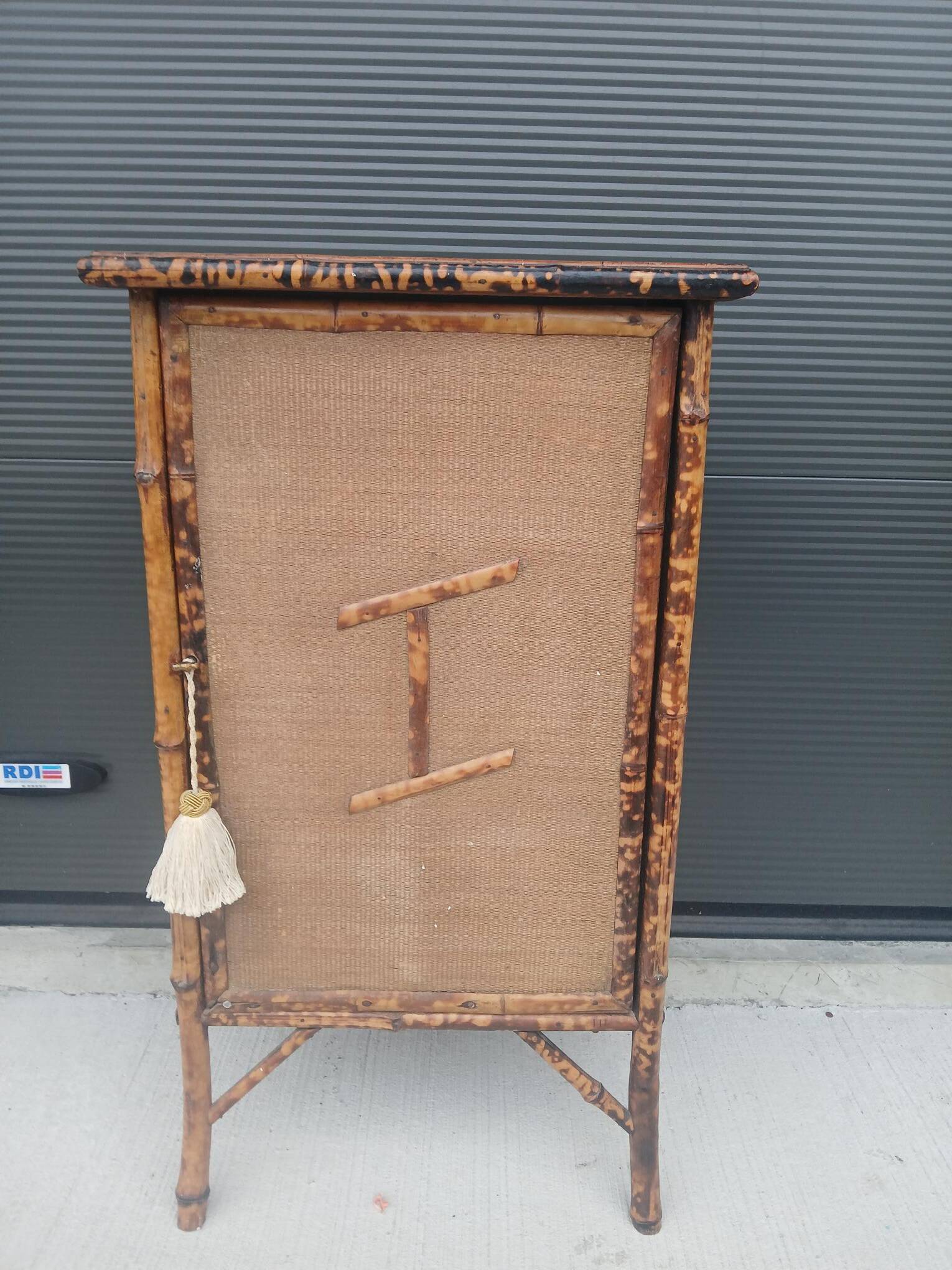 burnt bamboo wardrobe and grass cloth