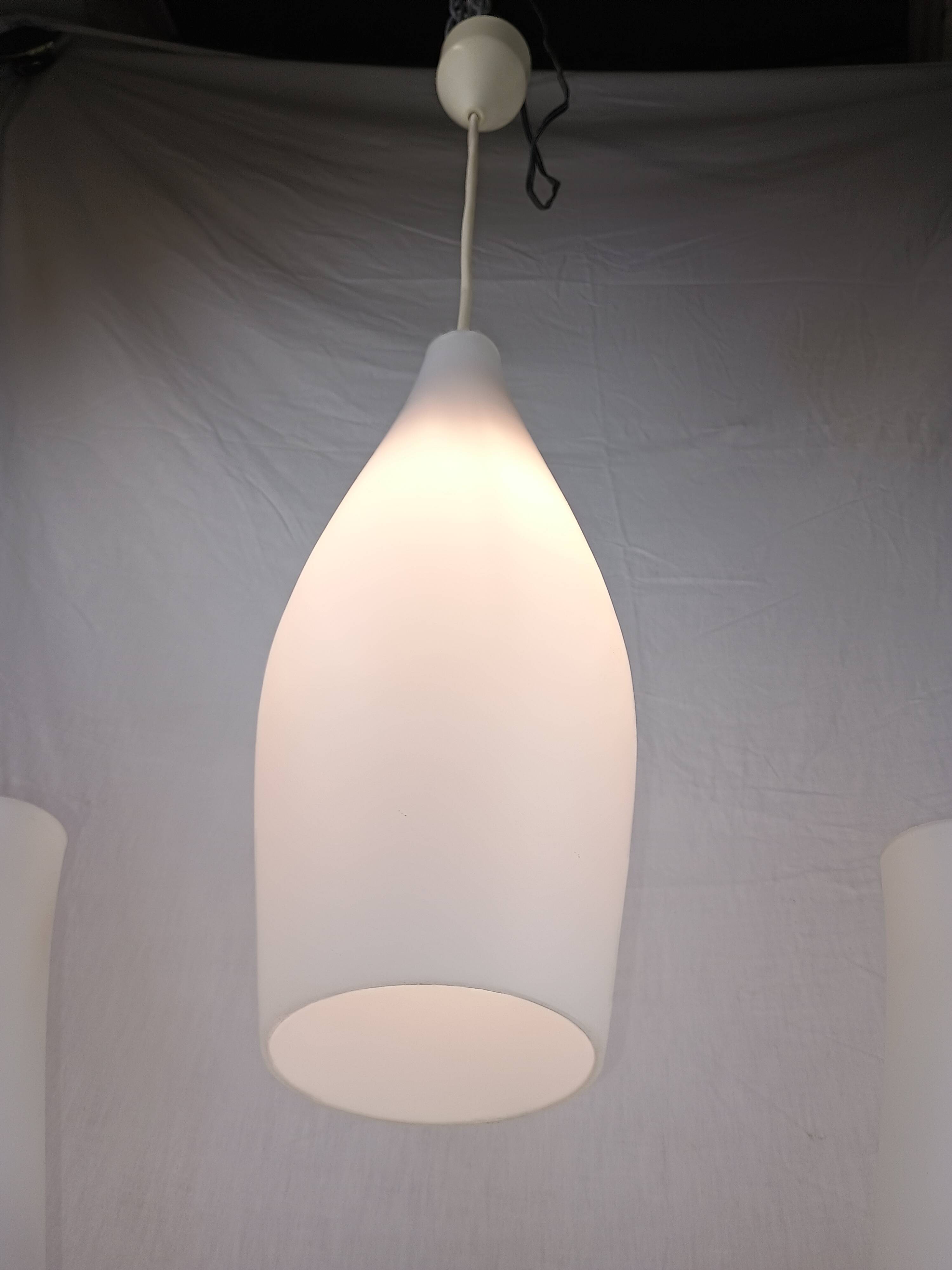 Superb set of three Holmegaard white opaline glass pendant lights