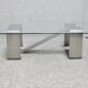 Coffee table with "kinetic" steel base and glass slab. Circa 1970.