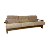 Old 3-seater sofa in solid wood, Maison Regain design, from the 70s.