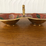 Empty pockets in brass and floral decoration