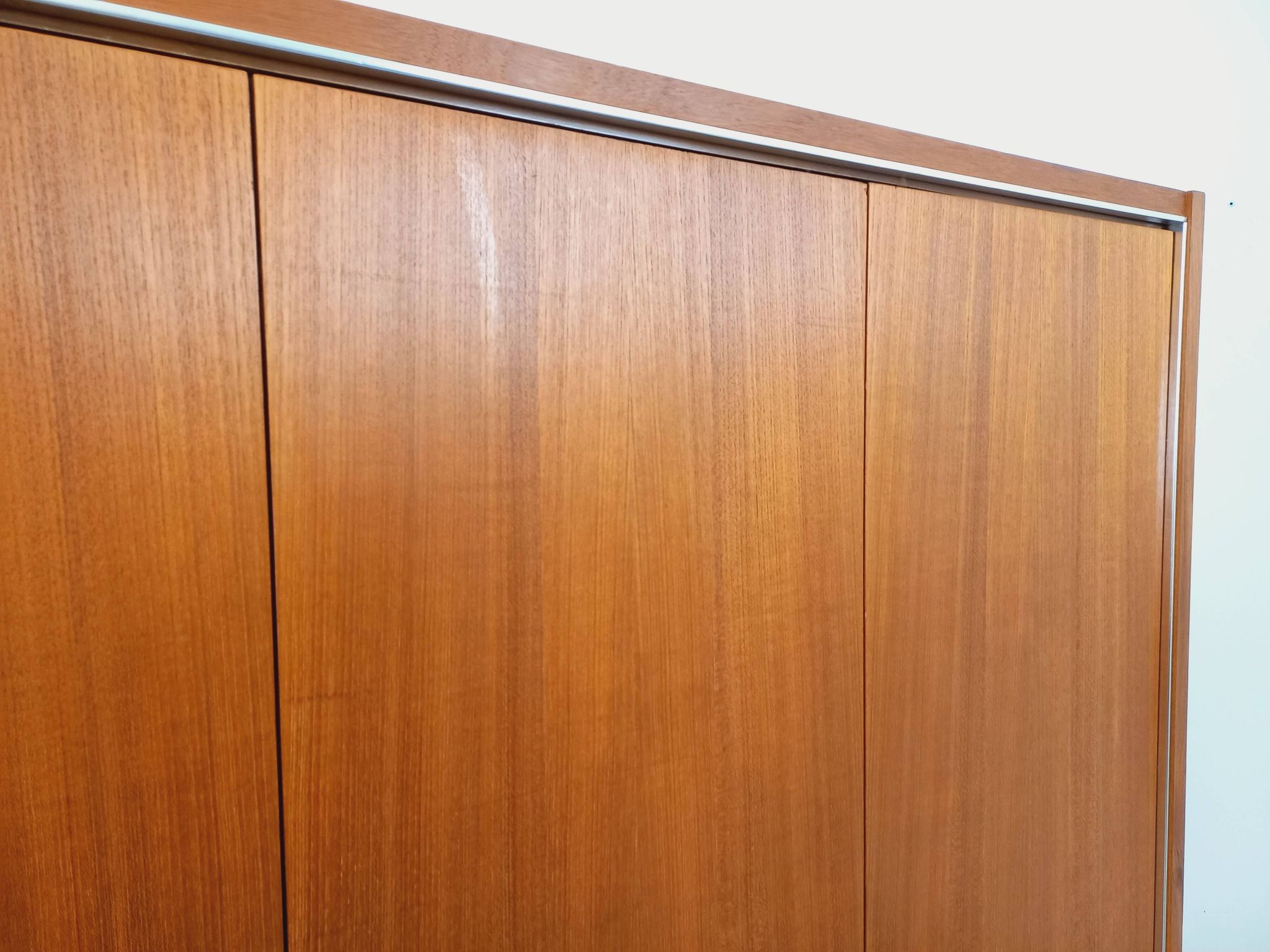 Vintage Scandinavian modernist wardrobe in teak and metal from the 1960s.