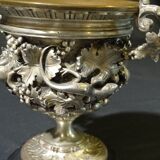 Carved silver bronze vase mounted on marble pedestal