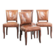 Set of 4 cognac-coloured cowleather dining chairs with decorative nails