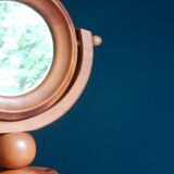 Round mirror psyche of wooden table