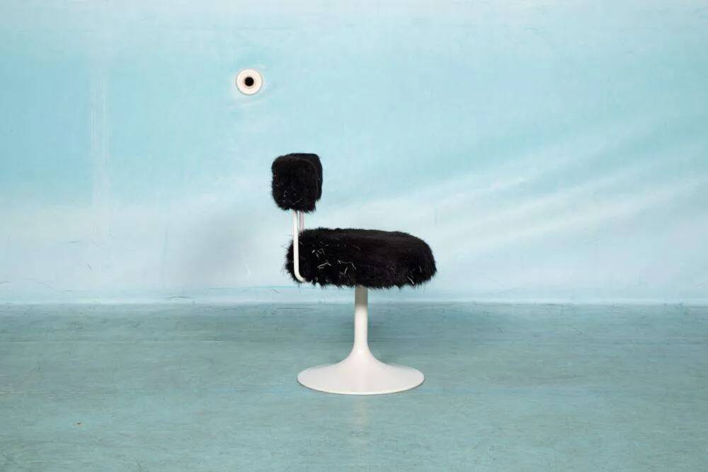 Space age design armchair from the sixties, fluffy stool with trumpet base.