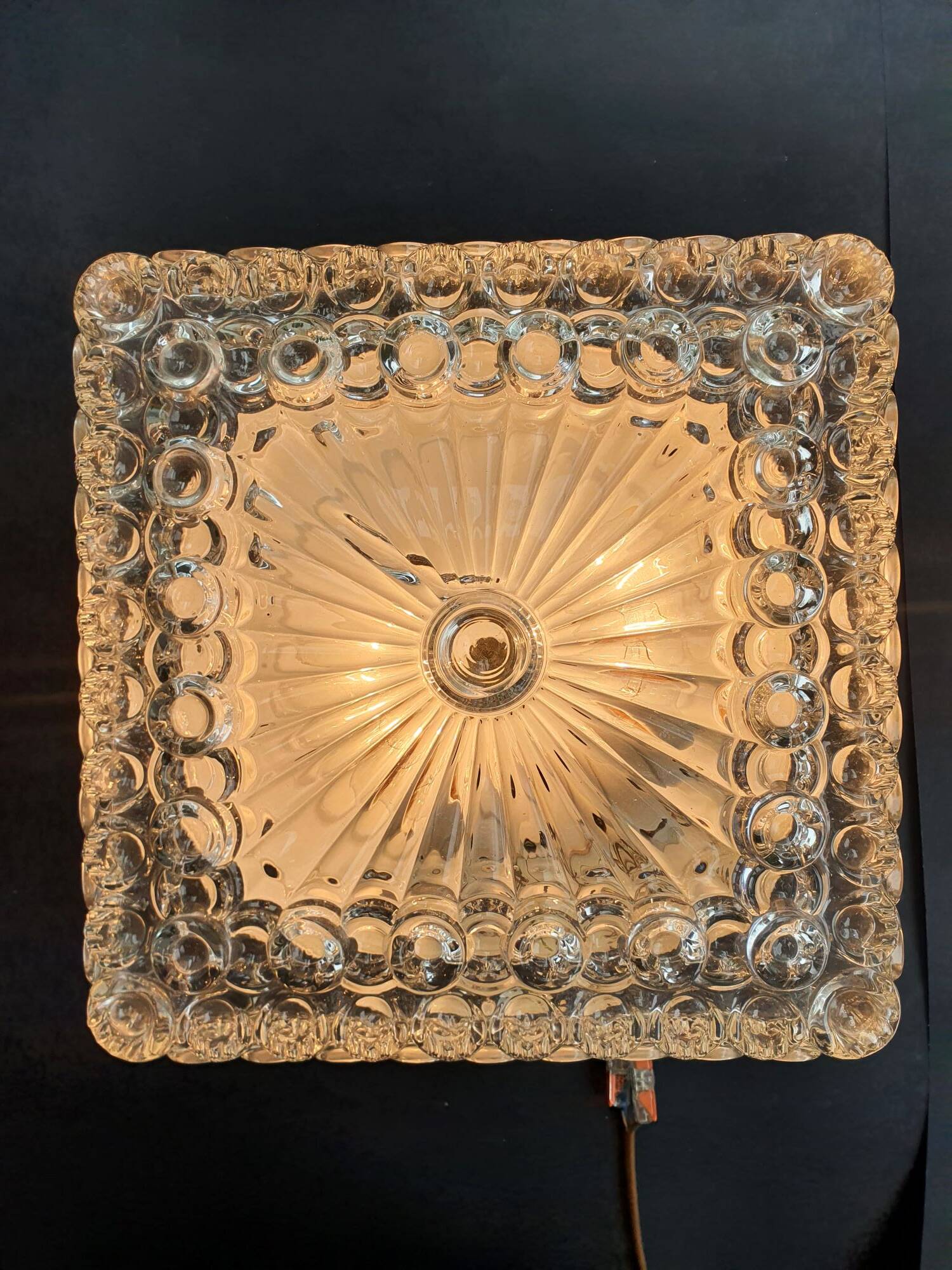 Large ceiling light or vintage wall sconce from the 1970s.