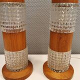 Swedish table lamps made of teak wood and hard pressed crystal glass.