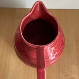 Raspberry-colored enamelled pitcher