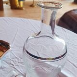 Blown glass decanter, engraved and chiselled. Made in France.